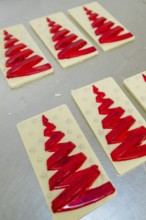 Red Christmas tree pattern on white chocolate bars, Christmas baking, Black Forest, Germany, Europe