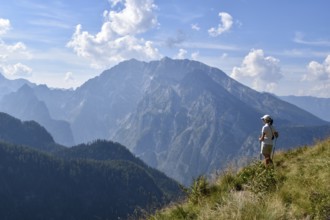 Hiker enjoying the view from the Rossfeldern to the Watzmann, Berchtesgaden National Park, Bavaria,