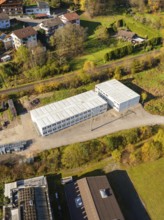 Building complex in autumnal landscape with vegetation, refugee accommodation Beermiß, Calmbach,