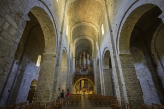 View of the entrance and the organ in the abbey of Gellone, also Saint-Guilhem-le-Désert monastery,