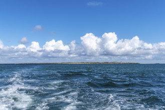 Dune of the high sea island Helgoland, south beach with lighthouse, swell, cloudy sky, sunshine,