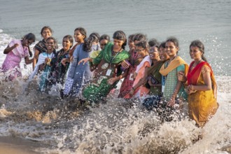 Group of laughing young woman standing in the surf, Adam's Bridge, Rameswaram Island, near