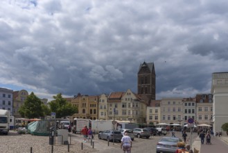 Market square with historic houses, behind the remaining tower of St Mary's Church, Wismar,