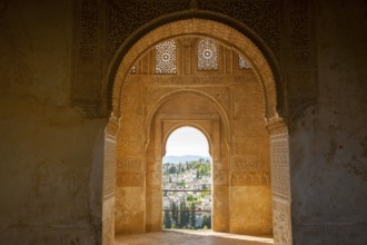 Stone arches in Islamic key shape in the Generalife palace, Alhambra, Granada, Spain, Europe