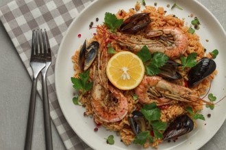 Seafood paella, shrimp and mussels risotto, rice, homemade, top view, no people