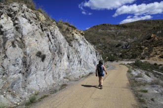 Woman walking in Sierra Alhamilla mountains, near Huebro, Nijar, Almeria, Spain, Europe