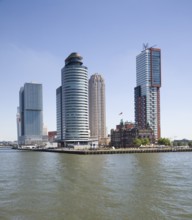 Historic Hotel New York building dwarfed by modern skyscrapers, Rotterdam, Netherlands