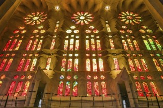 Colourful stained glass windows in the side aisle, Sagrada Familia, Basilica by Antoni Gaudi,