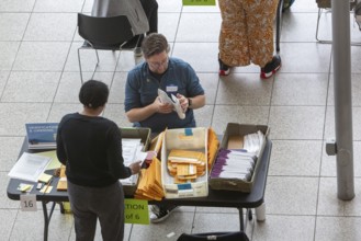 Warren, Michigan USA, 5 November 2024, Election workers open and verify absentee ballots on