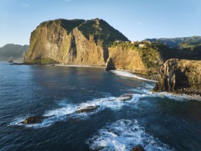 Aerial view of Madeira cliffs coastline landscape on sunrise, Guindaste viewpoint, Madeira island,