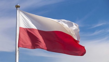 Flags, the national flag of Poland flutters in the wind