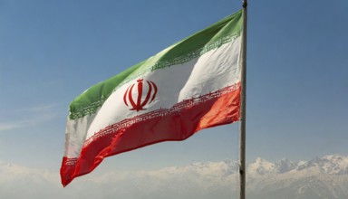 Flag, the national flag of Iran flutters in the wind