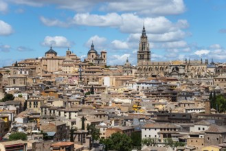 View of the old city centre with its historic buildings and towers under a cloudy skyline, on the