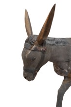 Head of the donkey, on a white background, detail of the palm donkey, wooden figure from around