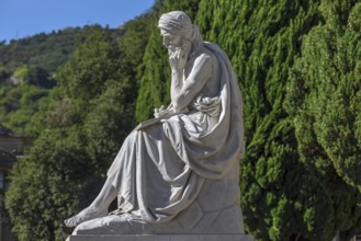 Sculpture with plaque in front of the Pantheon in the Staglieno Monumental Cemetery, Cimitero