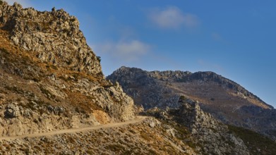 Mountain landscape with winding road and clear blue sky, Kallikratis, Kallikratis Gorge, Sfakia,