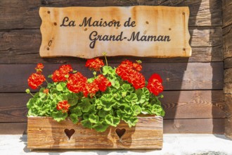 Information board for the local history museum La Maison de Grand-Maman, historic village centre,