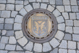 Municipal manhole cover with the coat of arms of Saalfeld, Kulmbach, Upper Franconia, Bavaria,