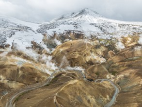 Steaming hot springs and colourful rhyolite mountains, aerial view, Hveradalir geothermal area,