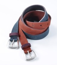 Leather belt in front of a white background, studio shot