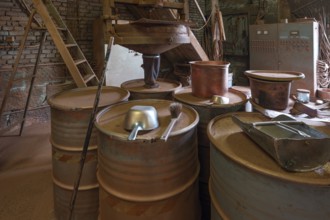 Bins for metal powder in the bronze powder filling room of a metal powder mill, founded in 1900,