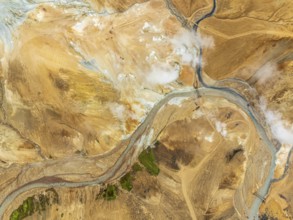 Steaming hot springs and colourful rhyolite mountains, aerial view, Hveradalir geothermal area,