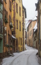 Alley in Riquewihr, winter, snowfall, Alsace, France, Europe