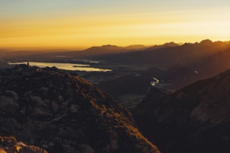 View from the Aggenstein to the Forggensee and the Ammergebirge at sunrise, Bavaria, Germany,