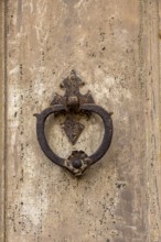 Door knocker on an old wooden gate, Galatina, Apulia, Italy, Europe