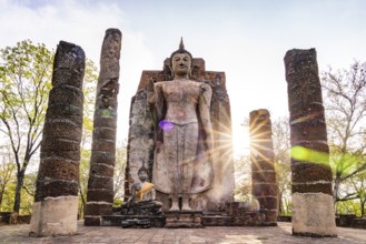 The giant standing Buddha in the temple Wat Saphan Hin, UNESCO World Heritage Sukhothai Historical