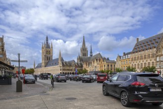 Cloth Hall with belfry and cars parked on the Grand Place at the city Ypres, Ieper, West Flanders,