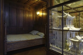 Bed and miniature ivory Chinese pagoda in the Louis XIV room at Kasteel van Gaasbeek, renovated