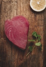 Fresh red tuna fillet, for steak, raw, top view, on a cutting board, no people