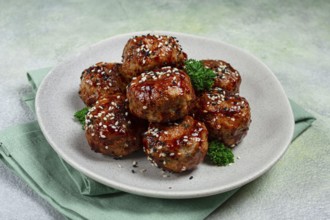 Tsukune, Japanese meatballs, minced chicken, fried on a skewer, with yakitori sauce, homemade, no