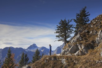 Walker looking over mountains from Mount Jenner in the Berchtesgaden National Park in autumn,