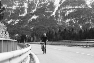 Road bike rider in spring between Lechtal and Tannheimer Tal in front of picturesque scenery of the