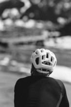 Road bike rider in spring in the Allgäu against the picturesque backdrop of the Alps, Bavaria,