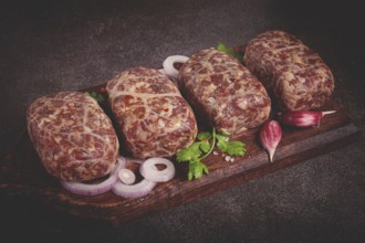 Raw apkhazura, a dish of Georgian cuisine, meat balls, minced meat wrapped in a fat net, seftalia,