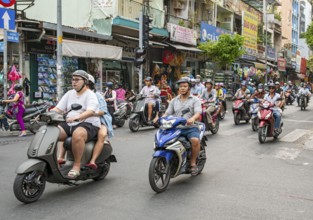 People on Motorcycles in the streets of Saigon, Ho Chi Minh City, Vietnam, Asia