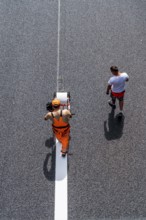 Marking work after the renewal of the road surface on the A40 motorway between the Kaiserberg