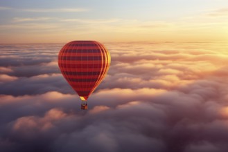 Colorful hot air balloon floats over a sea of clouds at sunset at sunset with orange and blue skies