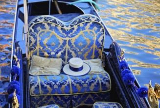 Luxury Gondola waiting for tourists near Rialto Bridge in Venice