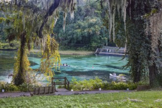 Canoes near swimming area of the Rainbow River in Rainbow River State Park, Florida, USA, North