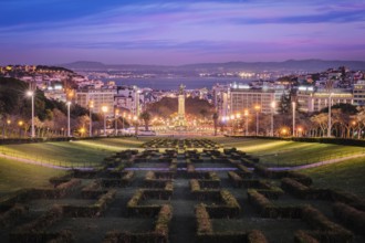 View of Lisbon Marquis of Pombal Square seen from the Eduardo VII Park in the evening twilight.