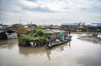 Morigaon, India. 4 July 2024. A settlement is partially submerged in flood in Morigaon district in