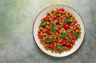 Tuscan pasta with smoked paprika and basil, parmesan cheese, Italian traditional cuisine