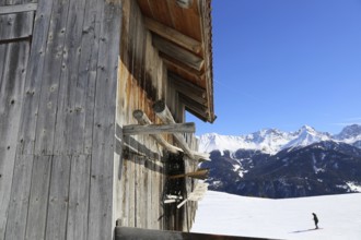 The Serfaus, Fiss, Ladis ski area in winter. In the foreground a wooden hut typical of the