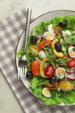 Vegetable salad, with quail eggs and olives, fresh, close-up, no people