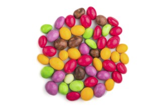 Pile of multicolored candies isolated on white background, chocolate dragees. close up, top view,