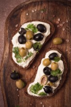 Breakfast, sandwiches, with cream cheese, olives, top view